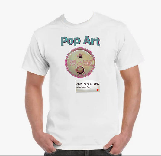 White t-shirt with 'Pop Art' design featuring the top of an old style soda can, with two push buttons instead of a pull tab. There's a gallery card under it, labelled, "Push First", 1982. Aluminum Can.